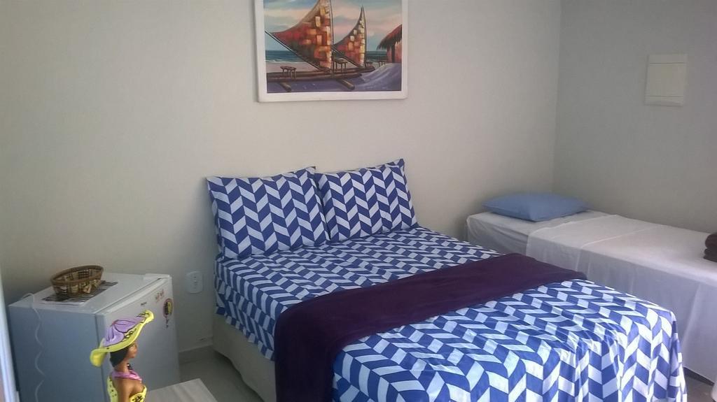 Quarto Triplo com Vista Piscina
