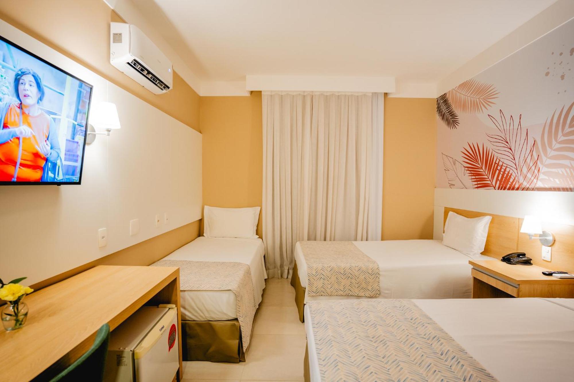 Quarto Triplo Standard com Camas Individuais