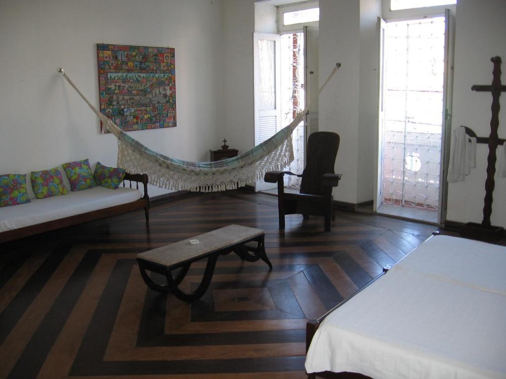 Quarto com Banheiro Compartilhado Externo