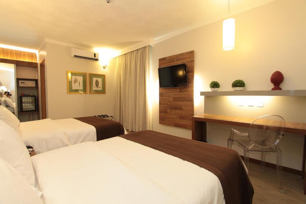 Quarto Duplo Deluxe com 2 Camas de Casal